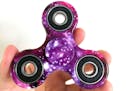 A D-JOY Tri-Spinner Fidget toy, sold on Amazon.com