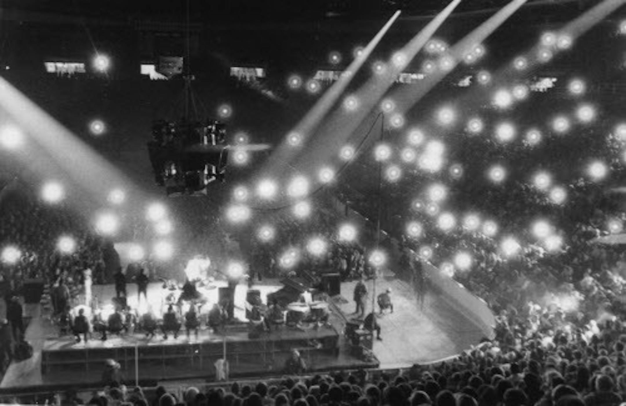 Flashbulbs popped almost continuously as Presley sang at Metropolitan Sports Center in November 1971.