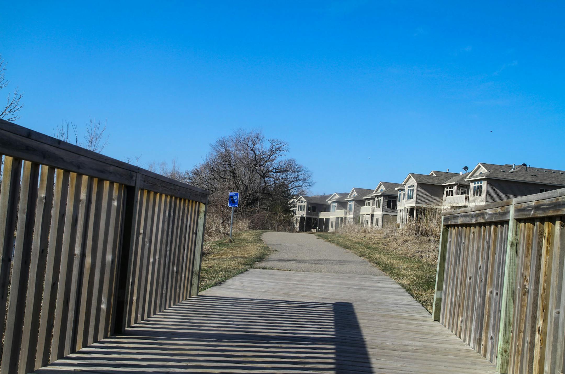 Walking path through a housing development alongside Jeffers Lake in Prior Lake.