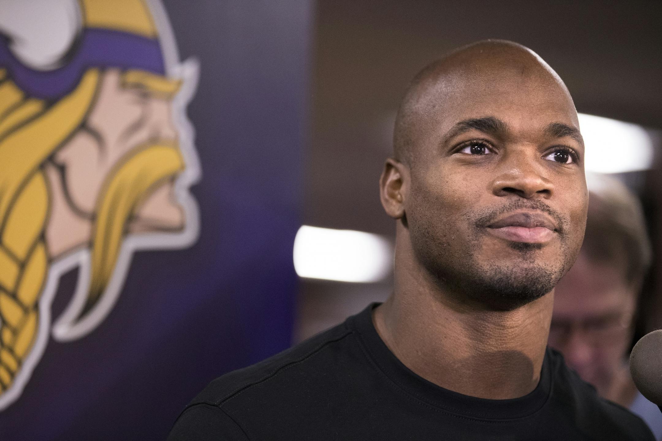 Adrian Peterson speaks to the media.