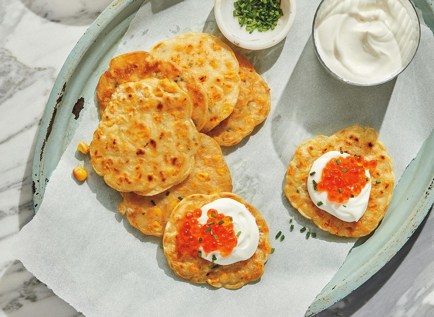 Corn Fritters with Salmon Roe, from "Eat, Drink and Be Murray (Day Street, 2022) by Andy Murray. Credit: Paul Strabbing