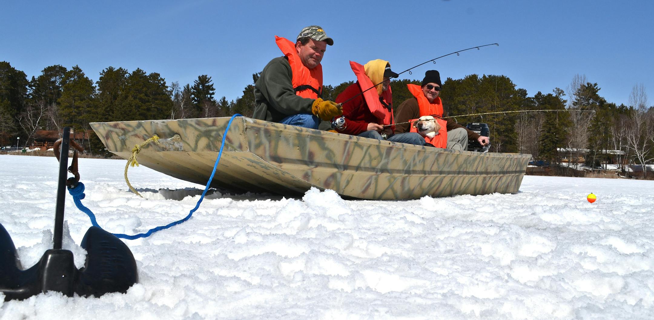 Organizers of the Governor’s Fishing Opener posed for this gag photo taken April 20 on Portage Lake, near Park Rapids, where Gov. Mark Dayton is scheduled to open the fishing season on May 11 — if the ice goes out. Hoping for open water were, from left, Park Rapids residents Matt Hirsch, Jason Durham and Butch De La Hunt.