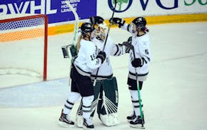 PWHL Boston's Gigi Marvin (19), who scored a goal Sunday vs. Minnesota, celebrated with teammates after a win earlier this season.