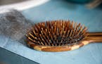 Annrene Rowe's hairbrush at her home in Anna Maria, Fla., on Sept. 18, 2020. Rowe was hospitalized for 12 days with coronavirus symptoms earlier this 