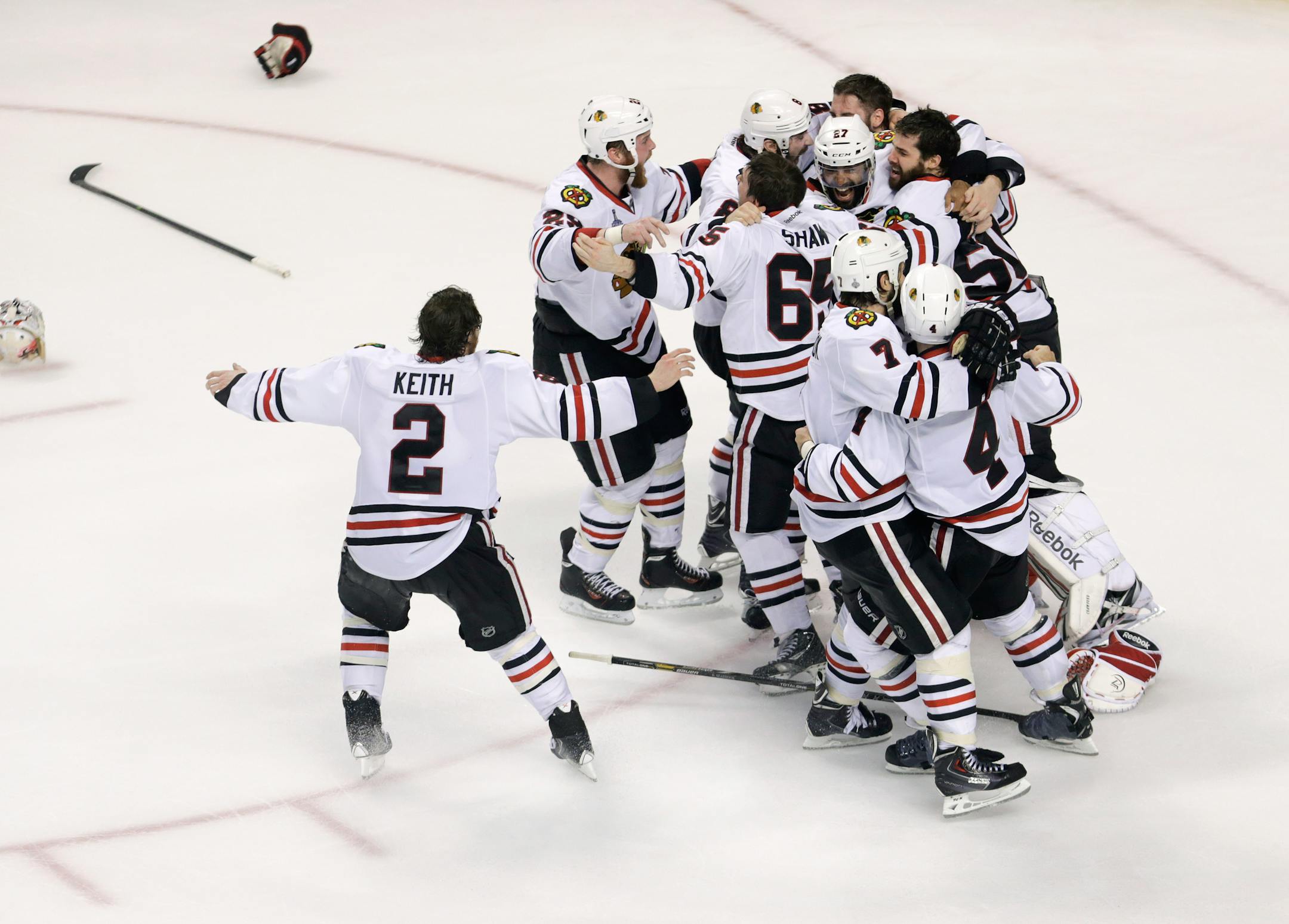 The Chicago Blackhawks celebrate their 3-2 win over the Boston Bruins in Game 6 of the NHL hockey Stanley Cup Finals, Monday, June 24, 2013, in Boston. (AP Photo/Charles Krupa)