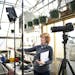 Diana Pierce worked with partner and "What's Next?" technical director Scott Bemman to set up for a videocast from Heidi's GrowHaus in Corcoran.