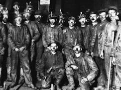 A group of miners posed for a photograph at an unknown Iron Range location around the turn of the 20th Century.