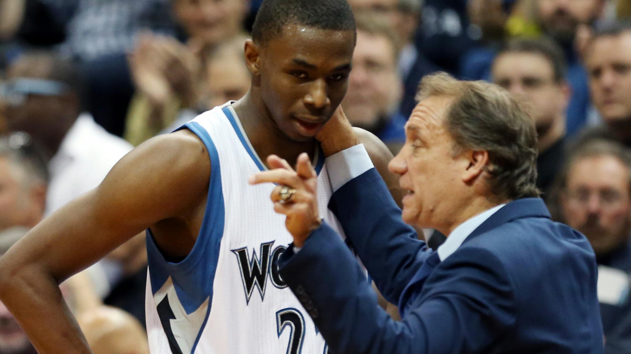 Minnesota Timberwolves head coach Flip Saunders gives pointers to rookie Andrew Wiggins as he headed to the bench in the second half of an NBA basketball game, Thursday, Oct. 30, 2014, in Minneapolis. The Timberwolves won 97-91. (AP Photo/Jim Mone) ORG XMIT: MIN2014110420594384 ORG XMIT: MIN1411042103004766