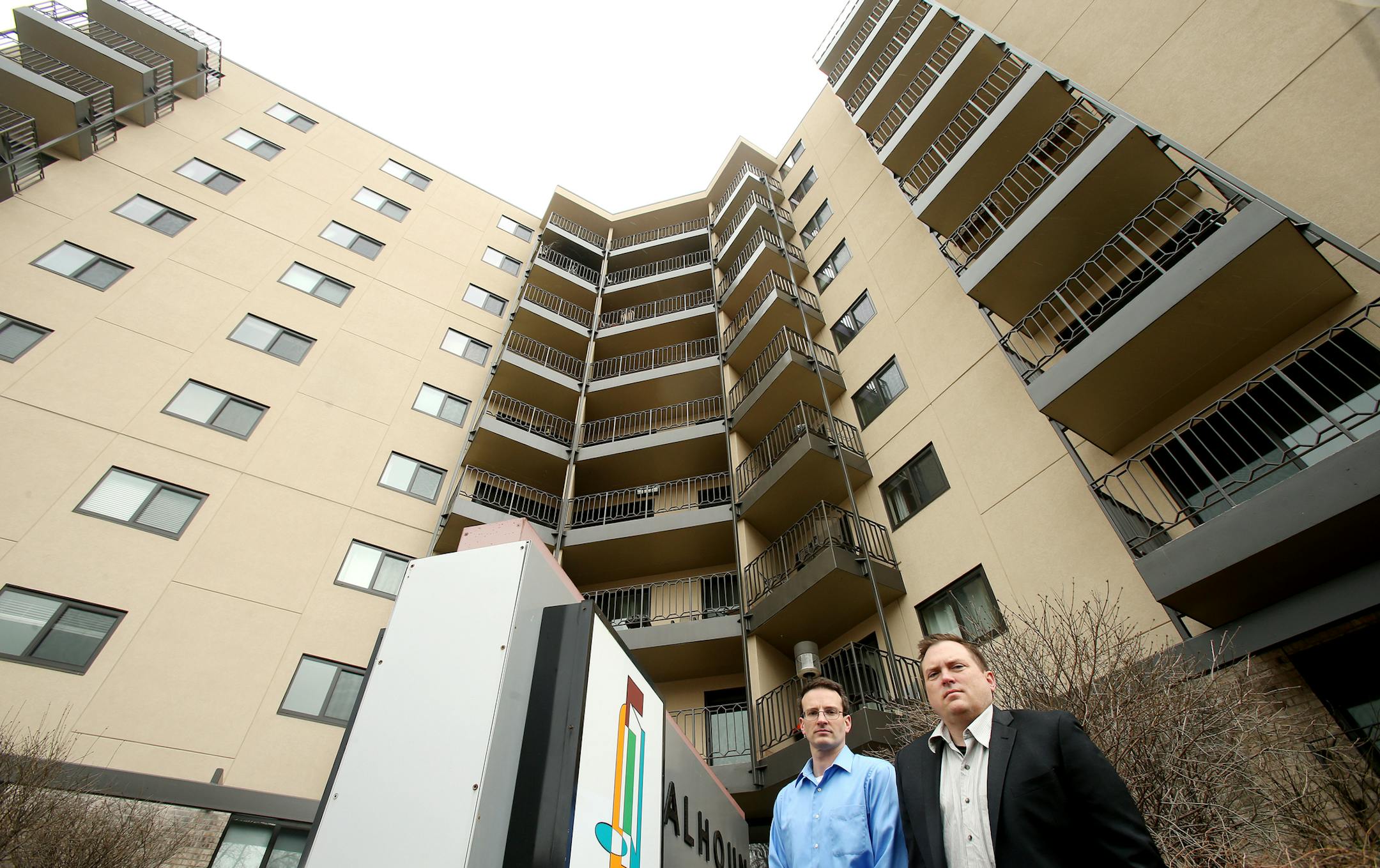 Encompass Principals Kent Jones (blue shirt) and Curt Isernhagen (suit) at Calhoun Place, the high-profile, nine-story condo building at 3131 Excelsior Blvd. ] JOELKOYAMA‚Ä¢jkoyama@startribune Minneapolis, MN on April 30, 2014..