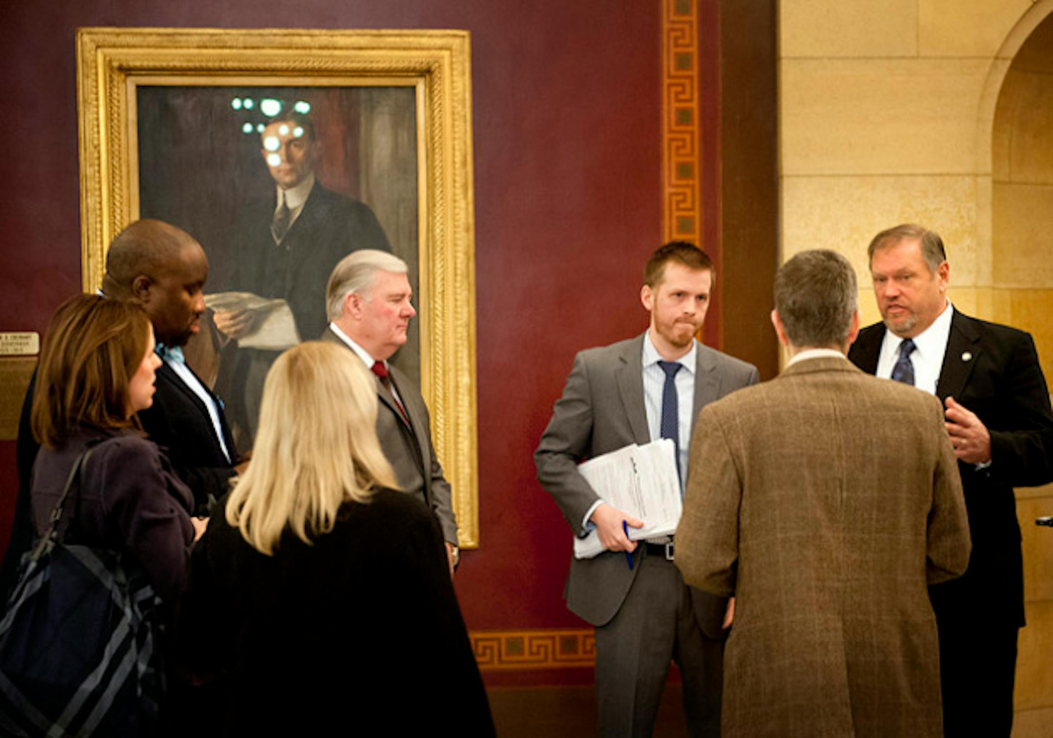 Senate Majority Leader Tom Bakk, right and Senate DFL communications director Amos Briggs, center, talked before the press conference with five senators authoring the first bills introduced for the 2013 session.  Senators clockwise from right are Tony Lourey, Chris Eaton, Katie Sieben, Jeff Hayden and Greg Clausen, Thursday, January 10, 2013 ]   GLEN STUBBE * gstubbe@startribune.com