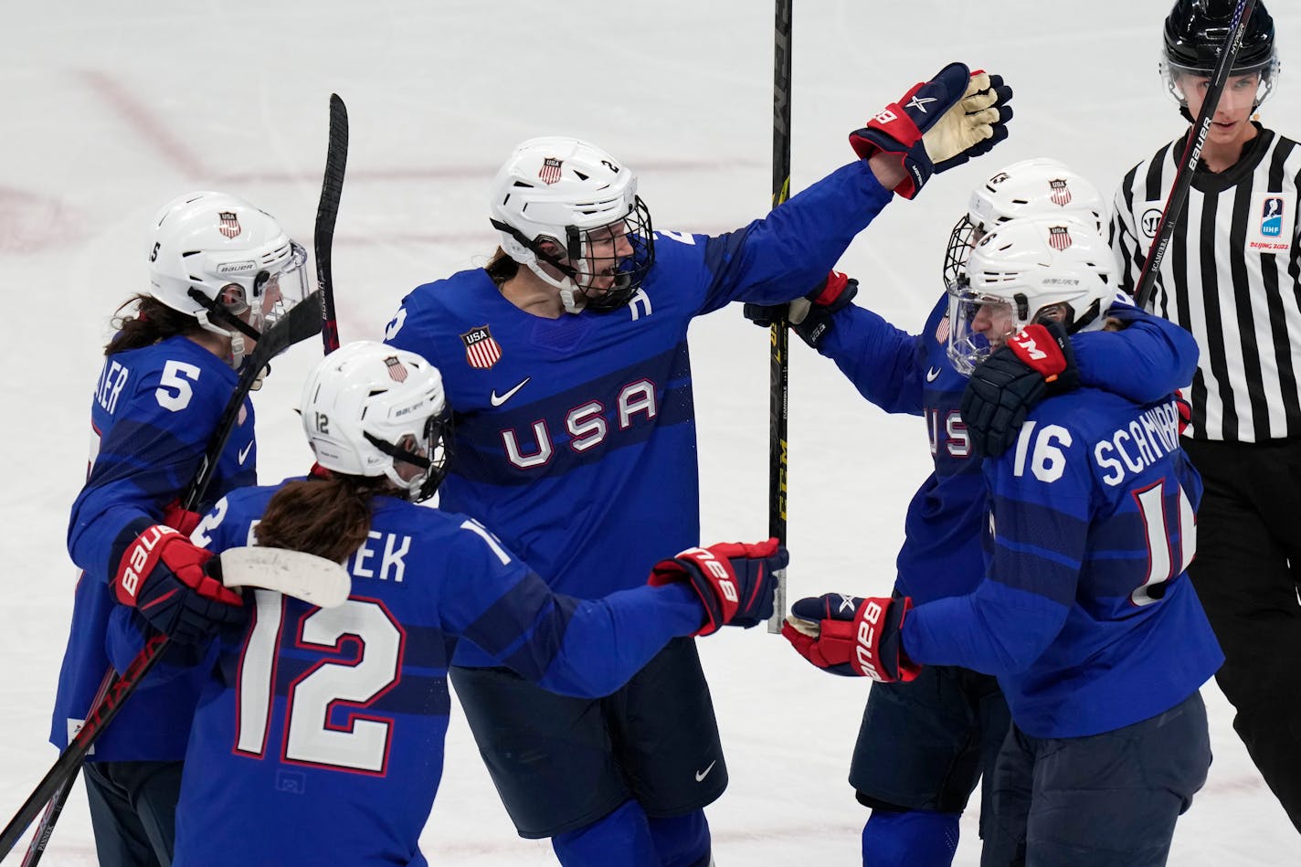 United States' Lee Stecklein (2) celebrates a goal with teammates during a women's quarterfinal hockey game against the Czech Republic at the 2022 Winter Olympics