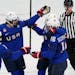 United States' Lee Stecklein (2) celebrates a goal with teammates during a women's quarterfinal hockey game against the Czech Republic at the 2022 Win