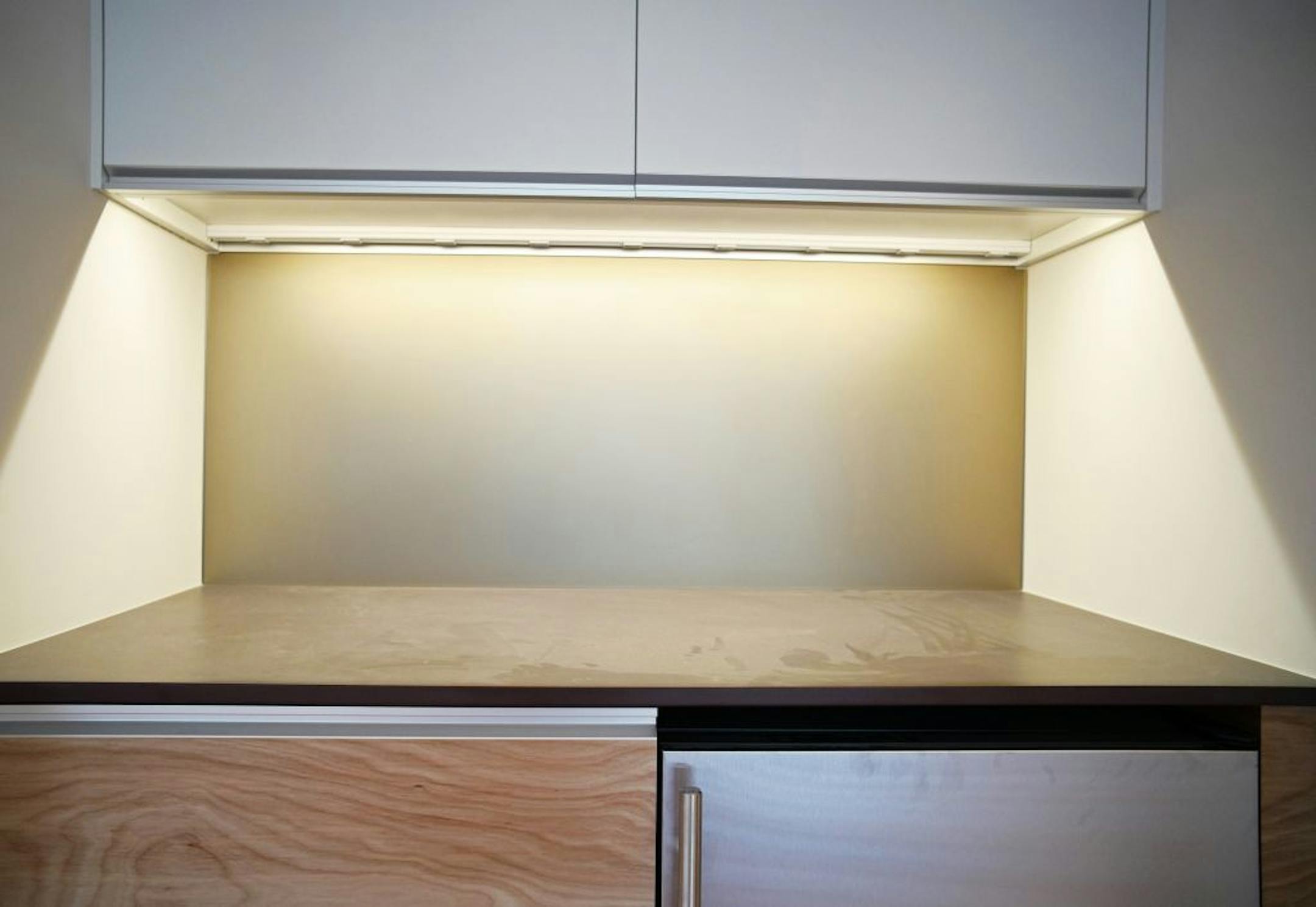Sandblasted satin-finish glass on backsplashes throughout the home.