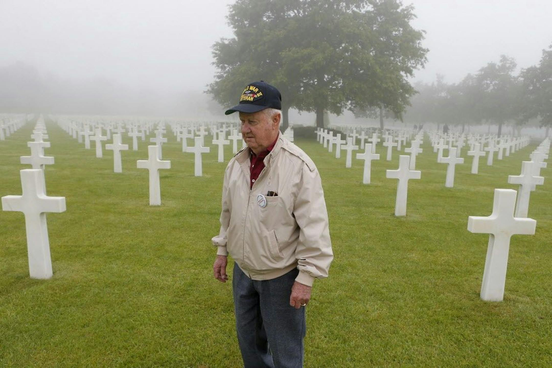 Henry Breton, a 91-year-old veteran from Augusta, Maine, who landed on the beach soon after dawn on D-Day in 1944 with the 106th Infantry Division, walks to pay respects and share memories with other survivors in the Colleville American military cemetery, in Colleville sur Mer, western France, Monday June 6, 2016, on the 72nd anniversary of the D-Day landing. D-Day marked the start of a Europe invasion, as many thousands of Allied troops began landing on the beaches of Normandy in northern Franc