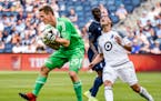 Sporting Kansas City goalkeeper Tim Melia (29) caught a scoring attempt from the Minnesota United on Saturday during the second half of the MLS soccer