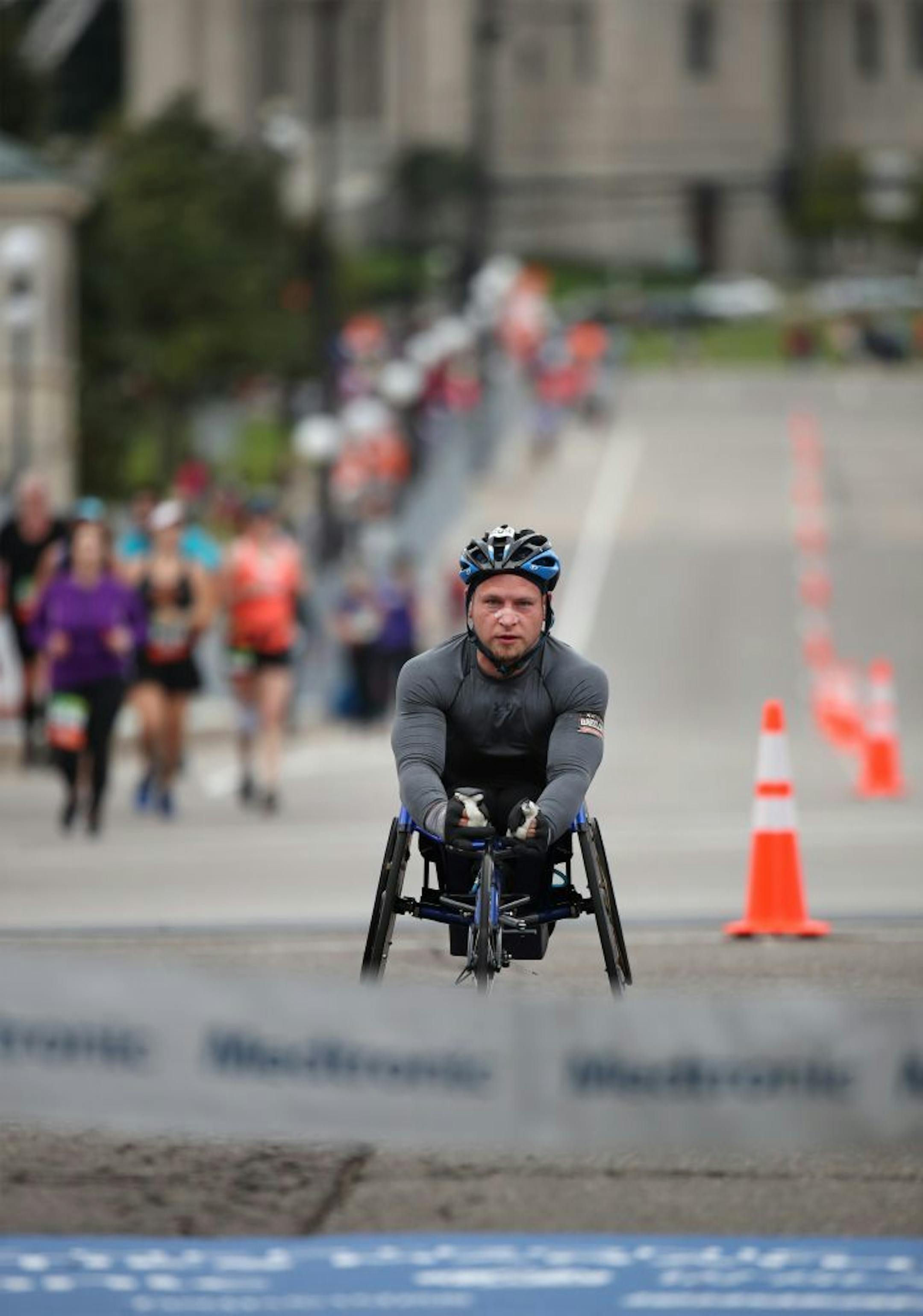 Matthew Porterfield won the wheelchair event asa he approached the finish line at the Capitol of the Twins Cities Marathon Sunday October 1,2017 in St. Paul, MN.