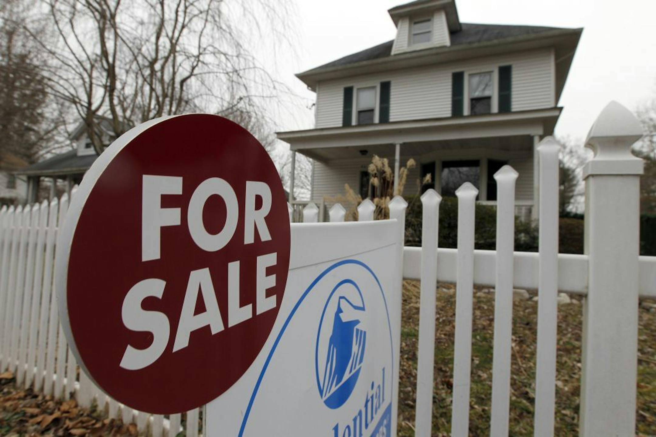 This Feb. 8, 2012 photo, shows a for sale sign in front of a home, in Yardley, Pa. The average rate on the 30-year fixed mortgage jumped after standing pat for three straight weeks at record lows. But the rate stayed below 4 percent for the 12th straight week, keeping home-buying and refinancing attractive for those who can qualify.