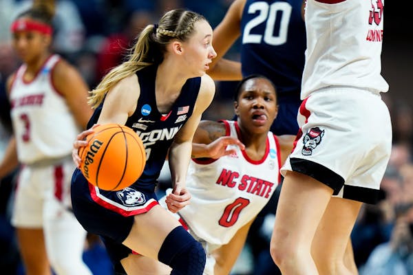 Connecticut guard Paige Bueckers (5) handles the ball against NC State during the fourth quarter.