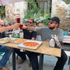 Rick Harrison, left, enjoys beer and pizza at St. Paul Brewing with Corey Harrison and Austin "Chumlee" Russell for an episode of "Pawn Stars Do Ameri