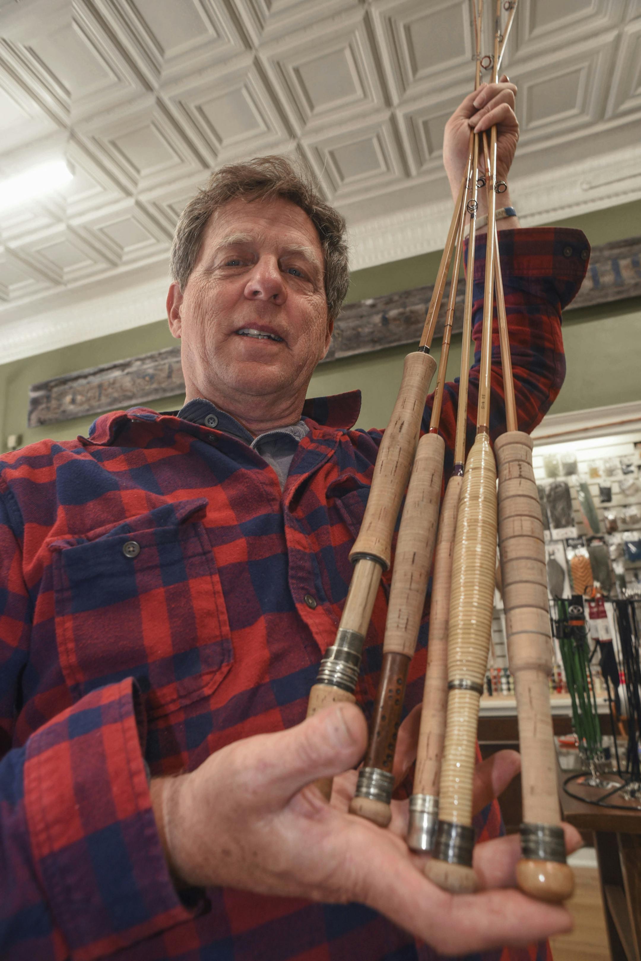 FILE - In this June 25, 2017 photo, Steve Sobieniak displays bamboo fly rods at Root River Rod Co. in Lanesboro, Minn. Steve Sobieniak hopes that decades from now, someone will pick up a fly rod he made, cast it, admire how it wafts out line in gentle curls and appreciate its lithe grace and bamboo beauty. It's a passion he brought to the area when he opened Root River Rod Co. May 1 in downtown Lanesboro. (John Weiss/The Rochester Post-Bulletin via AP)