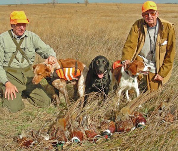 Dick Duerre (to Ed Crozier's left, with a haul of pheasants not many years ago in North Dakota.