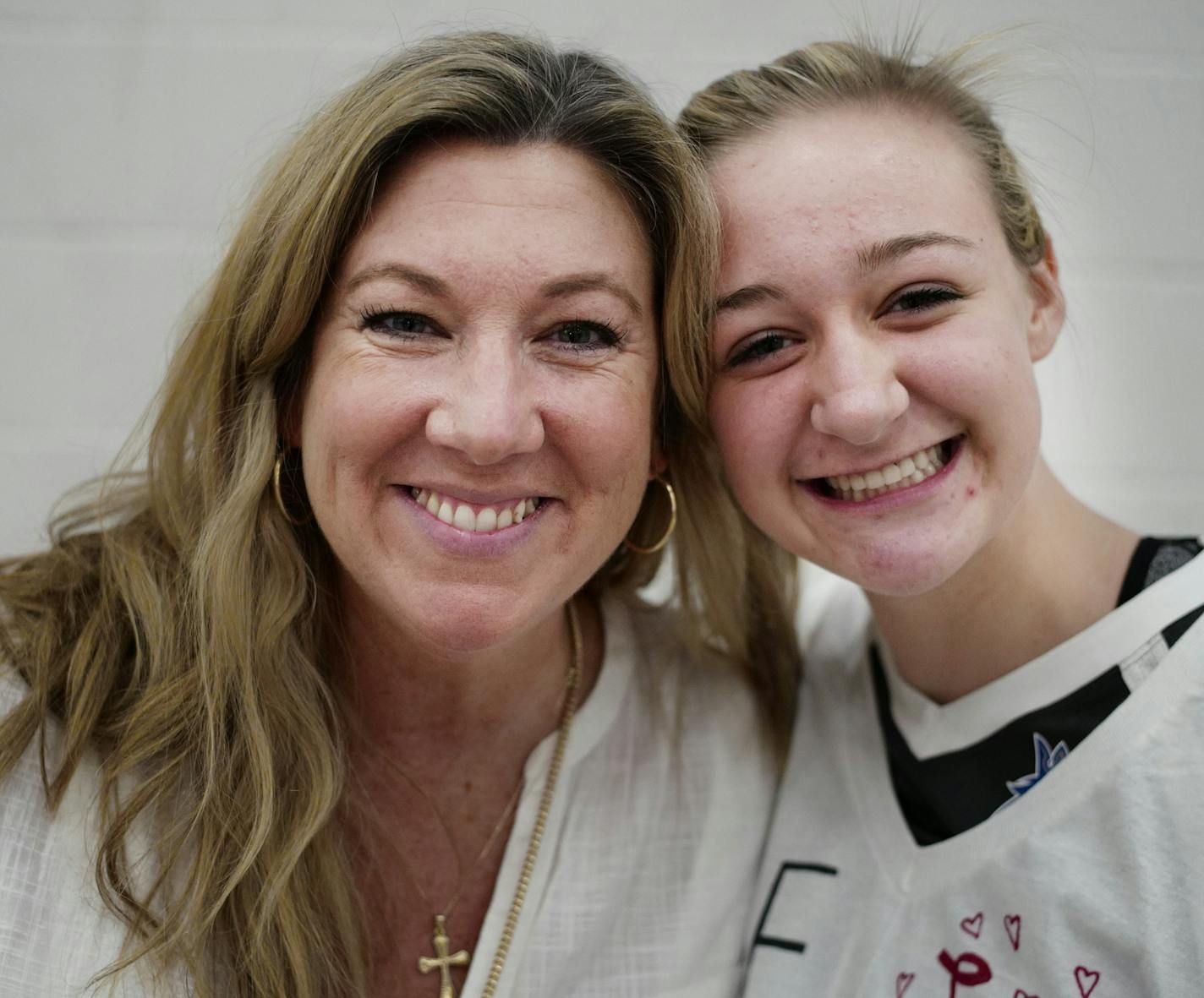 Hopkins junior setter Tara Lee and her aunt Vicki Seliger Swenson enclose a close and intense relationship during games.] Hopkins junior setter Tara Lee had her mother murdered in a highly-publicized domestic violence incident 10 years ago. Her aunt, Hopkins coach Vicki Seliger Swenson and husband Erik Swenson, took Tara and her siblings in and raised them. Tara is now the starting setter for Hopkins, one of the best teams in the state.Richard Tsong-Taatarii/rtsong-taatarii@startribune.com