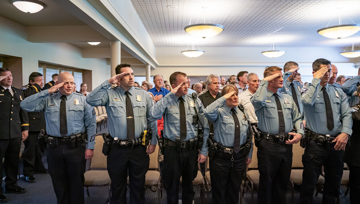 A Minneapolis police promotion ceremony in 2019. Ahead of a pivotal vote about the Minneapolis City Council's plan to remake policing, an analysis shows the council faces legal barriers to eliminating officers.