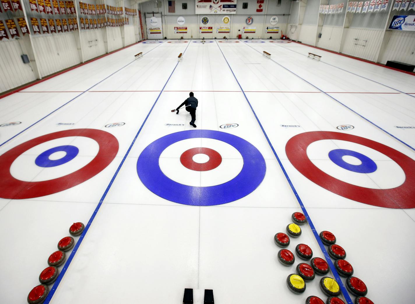 Alone in an empty Bemidji Curling Club Pete Fenson practiced delivering the rock on Thursday. Fenson and his team won a Bronze medal in the 2006 Winter Olympics. It was the first Olympic medal for the United States in curling. ] CARLOS GONZALEZ cgonzalez@startribune.com November 7, 2013, Bemidji, Minn., - Olympic Curler Pete Fenson Bemidji Curling Club