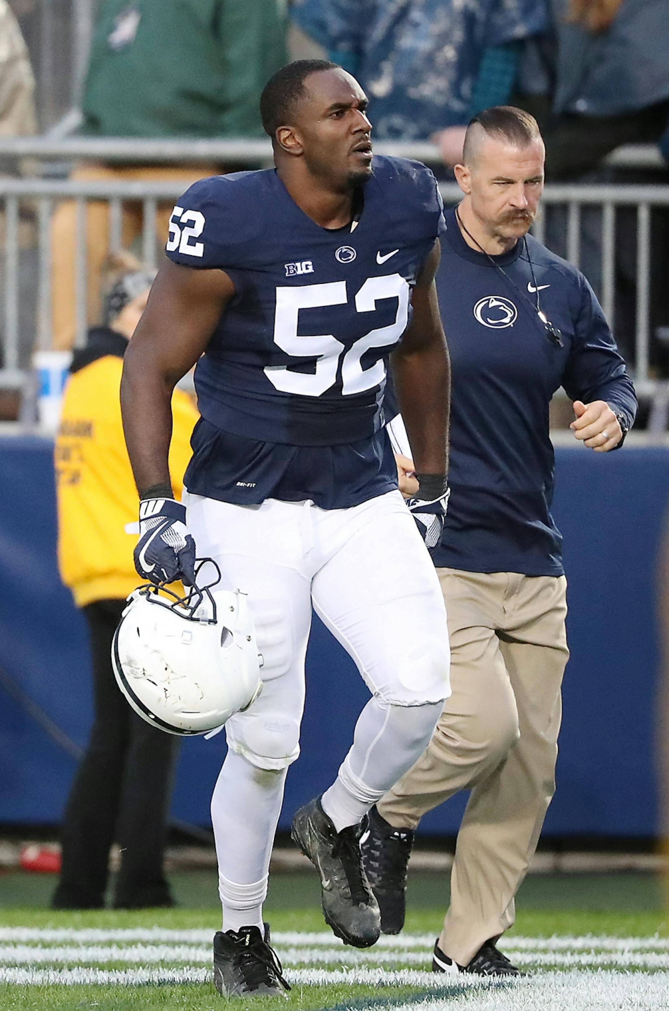 Penn State's defensive tackle Curtis Cothran was escorted off the field after a personal penalty in the third quarter as Minnesota took on Penn State at Beaver Stadium, Saturday, October 1, 2016 in State College, PA.