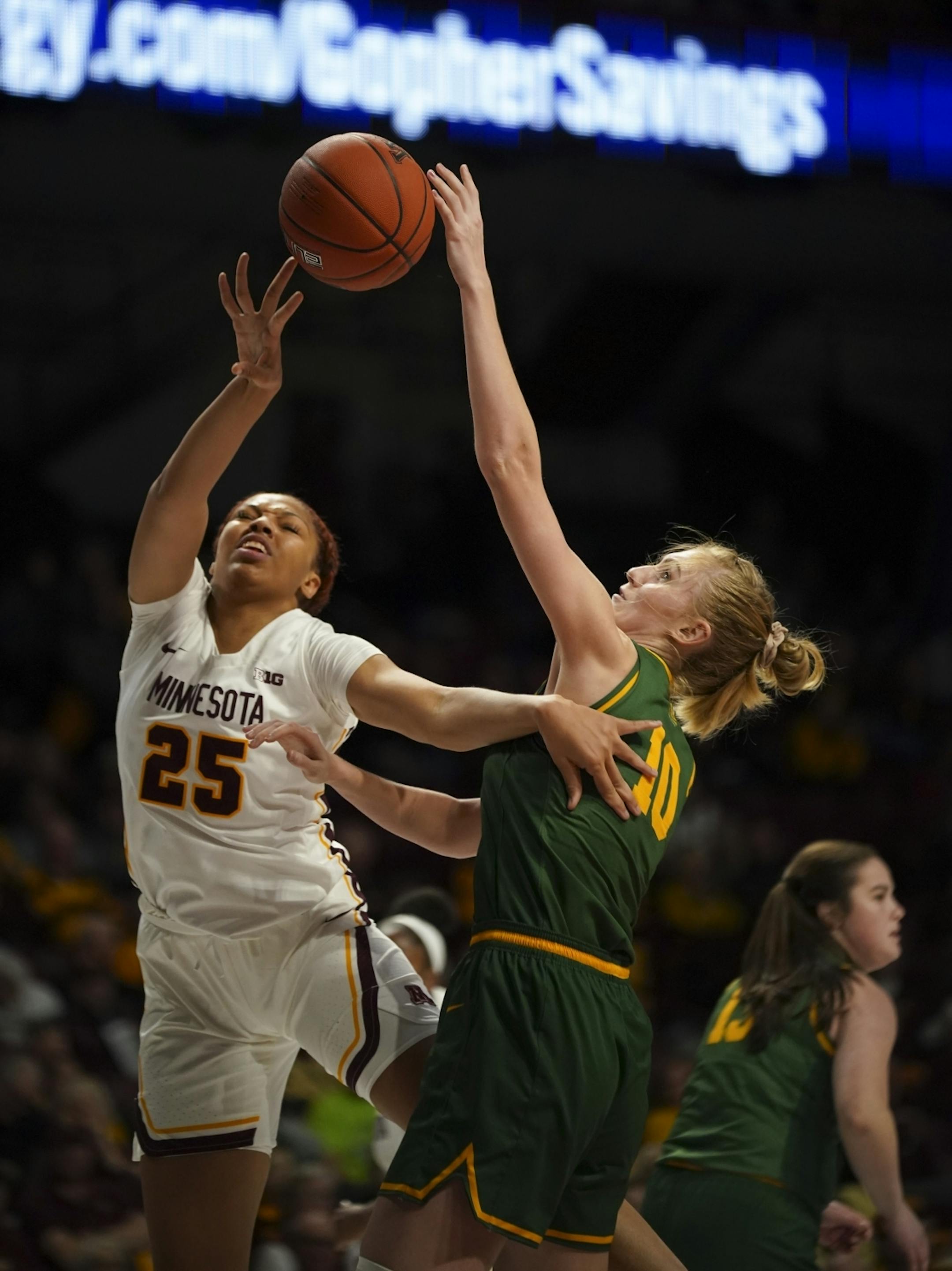 Vermont Catamounts forward Hanna Crymble (10) blocked a fourth quarter shot by Minnesota Golden Gophers center Klarke Sconiers (25).