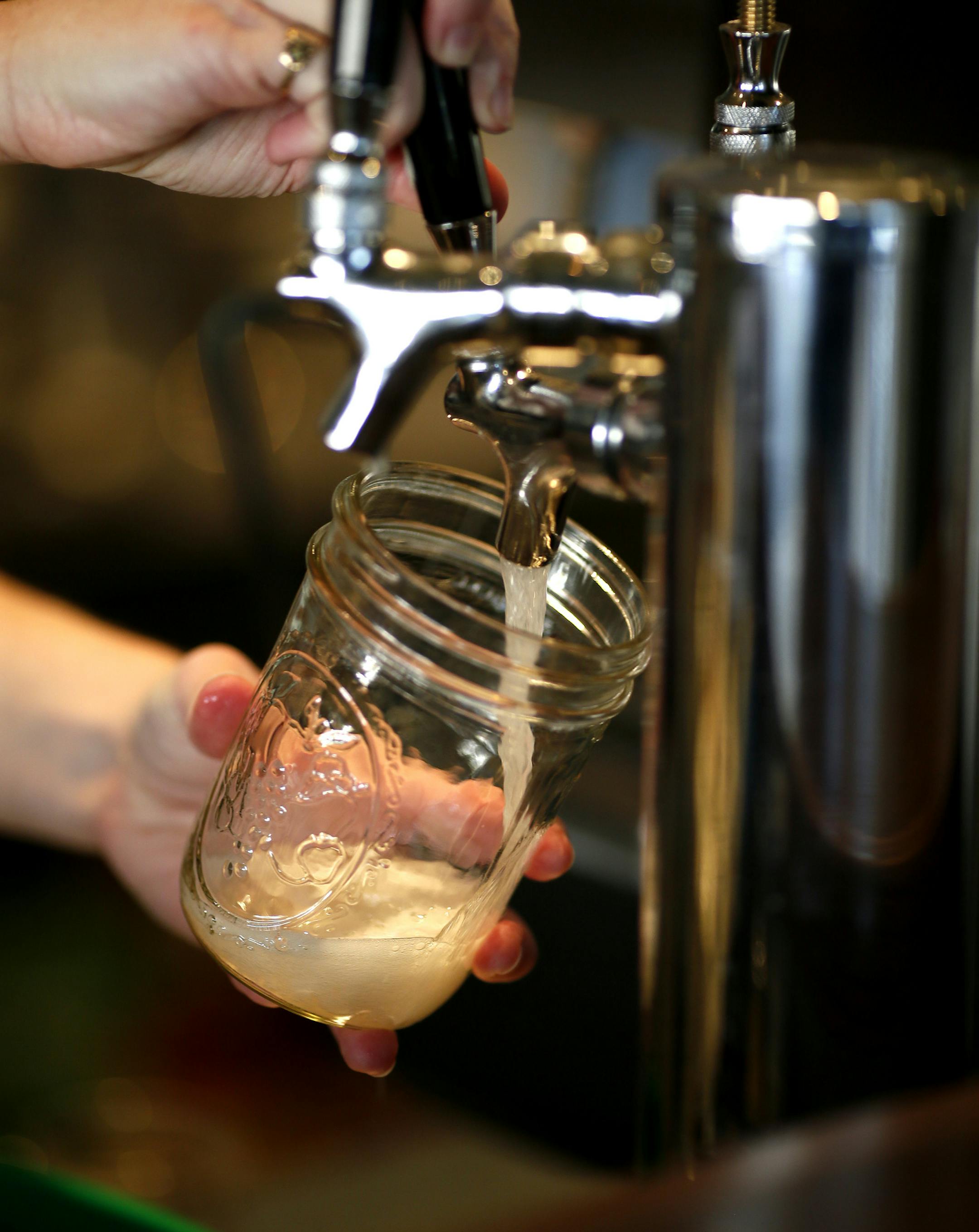 Lily Ducker owner of the Verdant Tea tasting room and tea bar poured a glass of kombucha November 10, 2013 in Minneapolis , MN. ] JERRY HOLT ‚Ä¢ jerry.holt@startribune.com