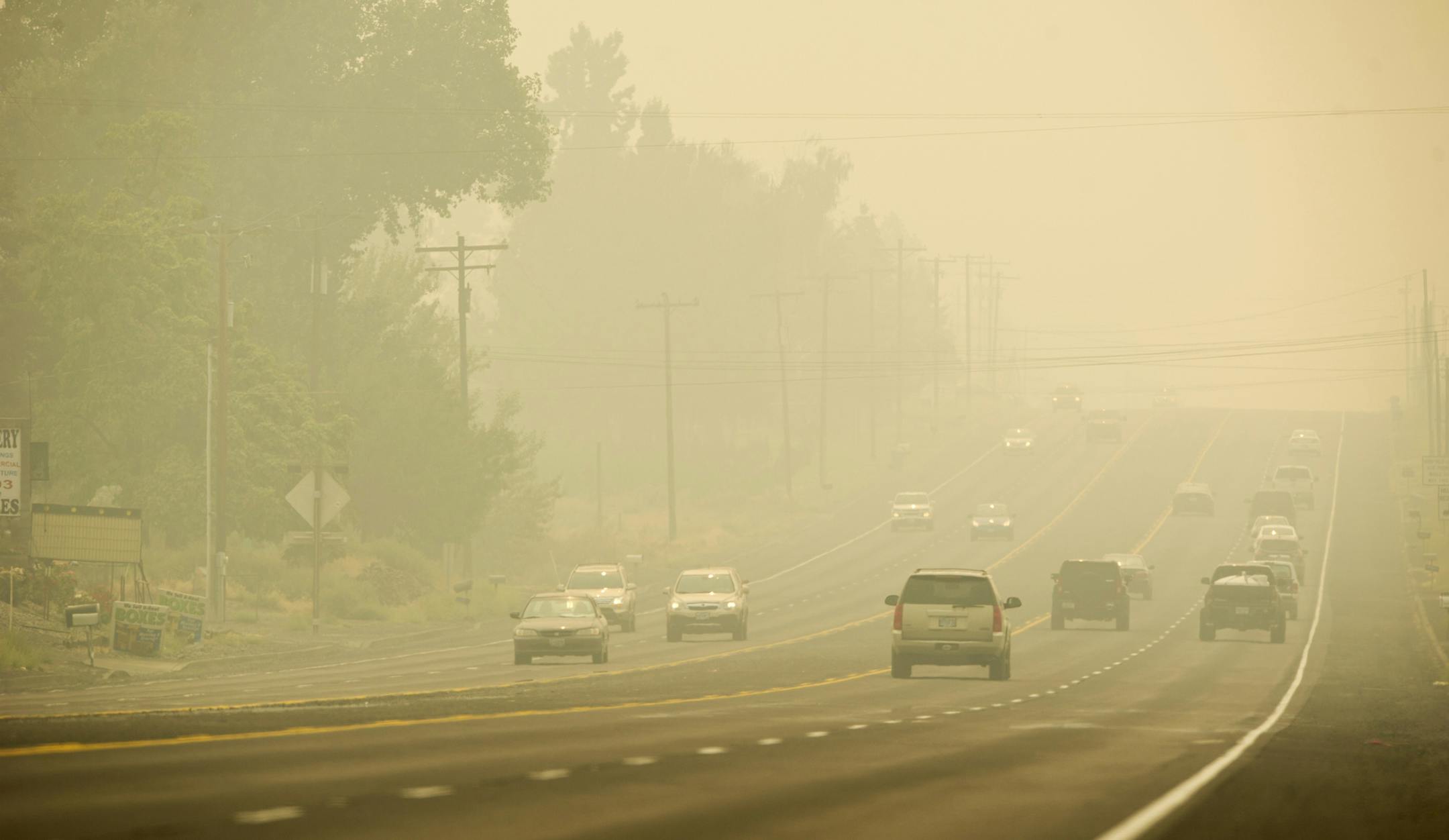 Looking south toward Milton-Freewater, Ore., along Hwy 11, Tuesday, Sept. 5, 2017. A growing Oregon wildfire covered parts of Portland's metropolitan area Tuesday with ash and forced the shutdown of a lengthy stretch of highway through the state's scenic Columbia River Gorge. It was one of dozens of wildfires burning in western U.S. states that sent smoke into cities from Seattle to Denver &#x2014; prompting health warnings and cancellations of outdoor activities for children by many school dist