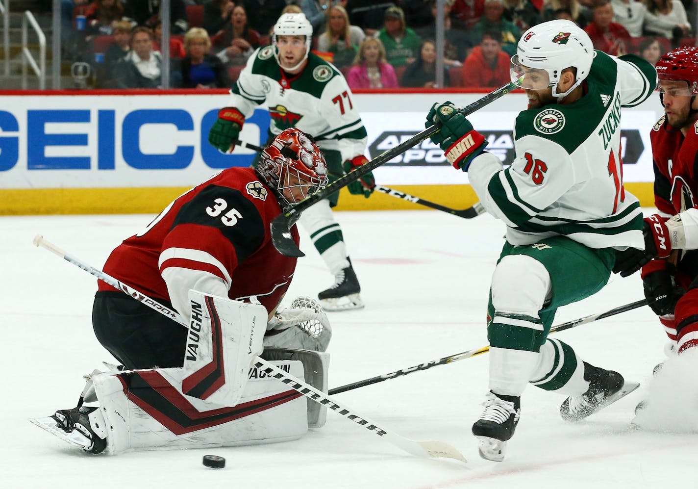 Arizona goaltender Darcy Kuemper makes a save on a shot by Wild left wing Jason Zucker