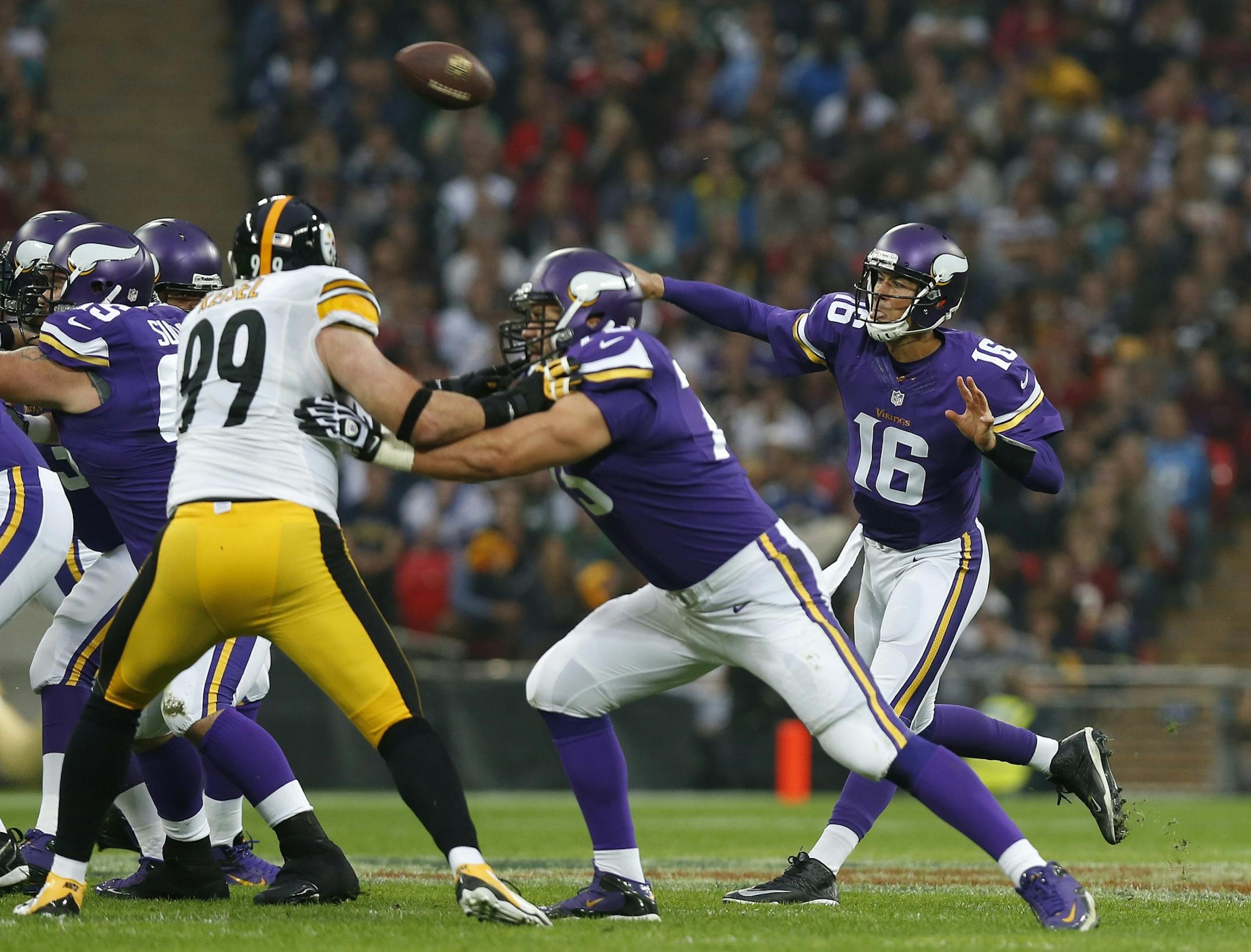 Minnesota Vikings quarterback Matt Cassel , right, passes the ball during the NFL football game against Pittsburgh Steelers at Wembley Stadium, London , Sunday, Sept. 29, 2013.