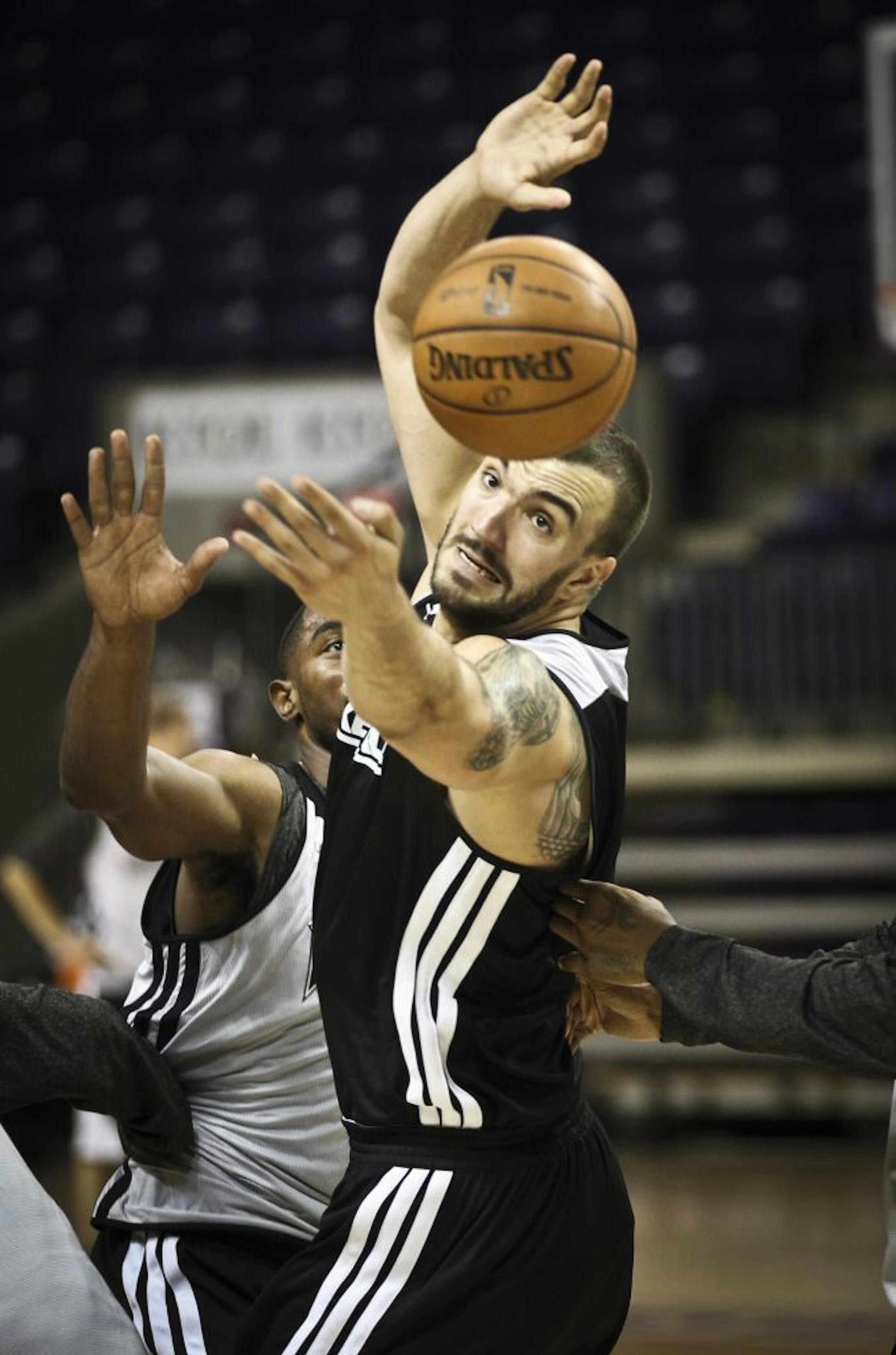 Nikola Pekovic grabbed for a loose ball during Timberwolves training camp