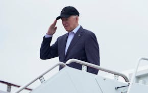 President Joe Biden salutes as he boards Air Force One as he leaves Andrews Air Force Base, Md., on his way to his Delaware home, Friday, April 19, 20