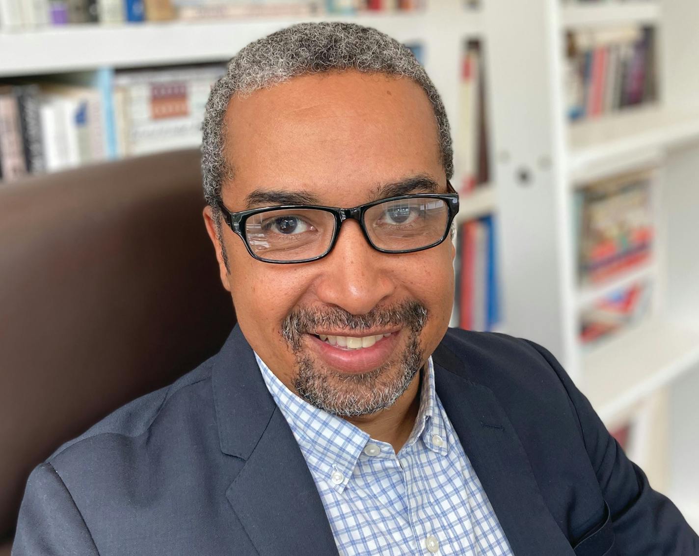 photo of author Jerald Walker in front of a bookcase