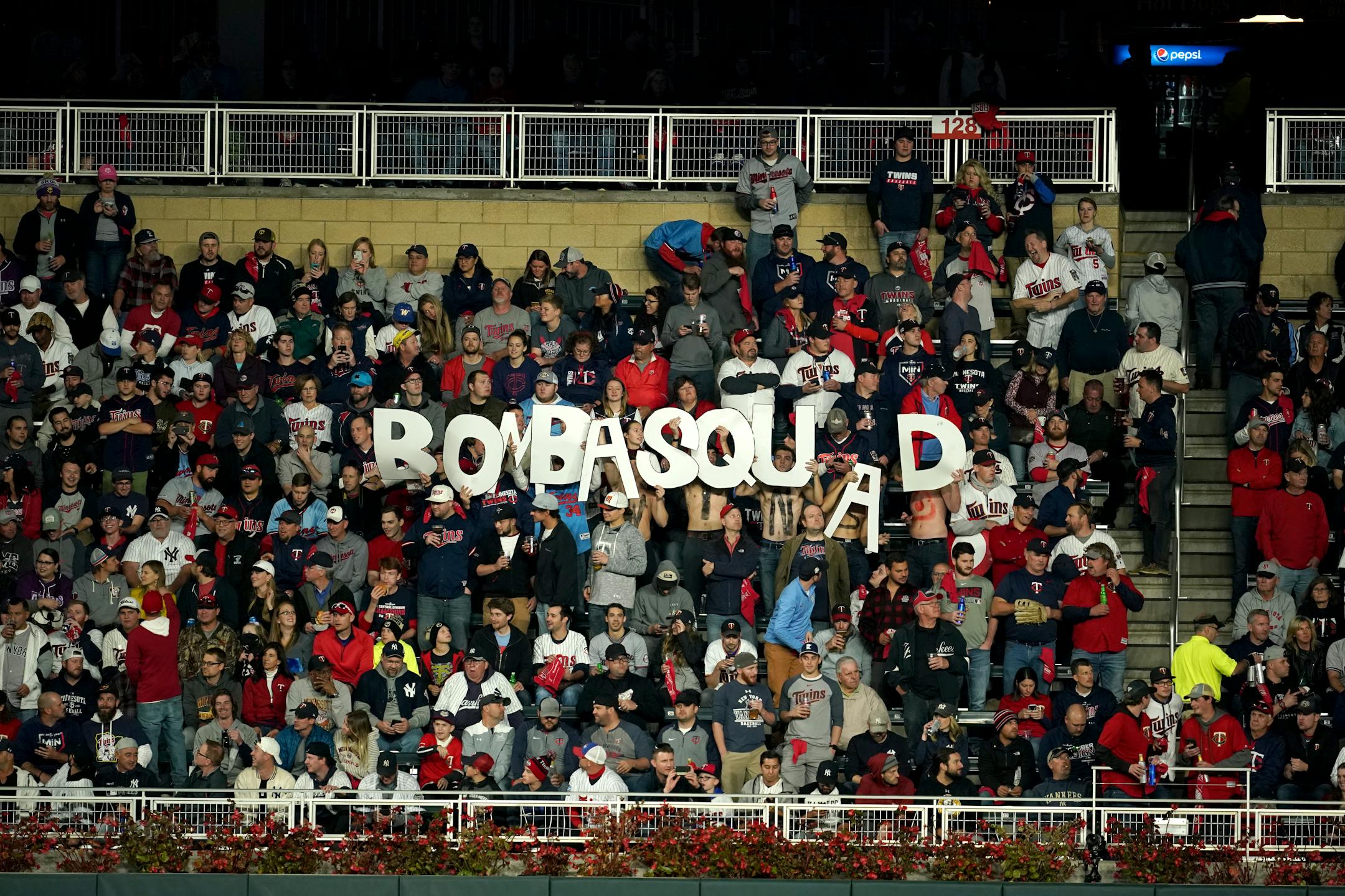 Fans held up a BombaSquad sign during last season's playoffs at Target Field.