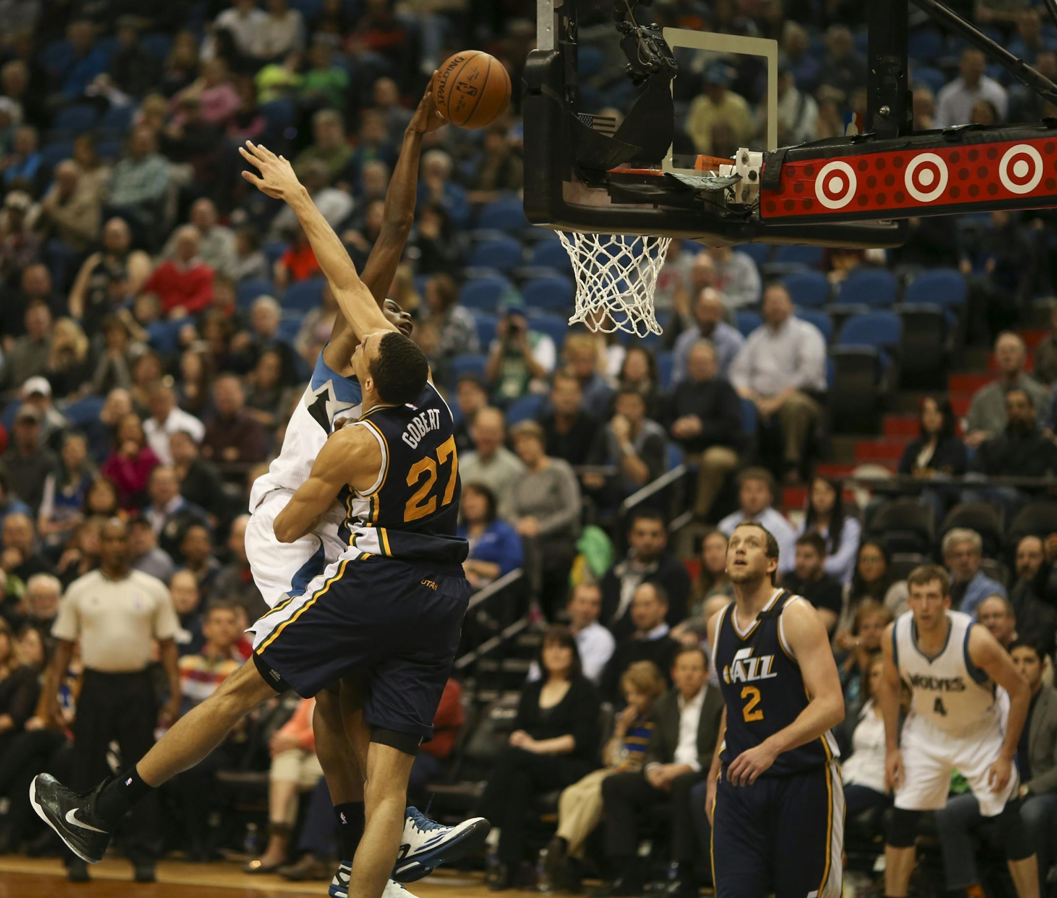 Minnesota Timberwolves forward Andrew Wiggins dunked in the second quarter over Utah Jazz center Rudy Gobert Monday night at Target Center.