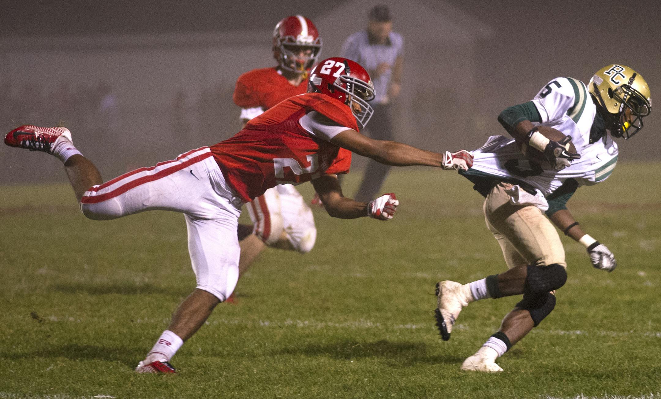 Park Center's Ty'Shonan Brooks, right, still feels a bond with that 2011 Brooklyn Park Saints eighth-grade team.