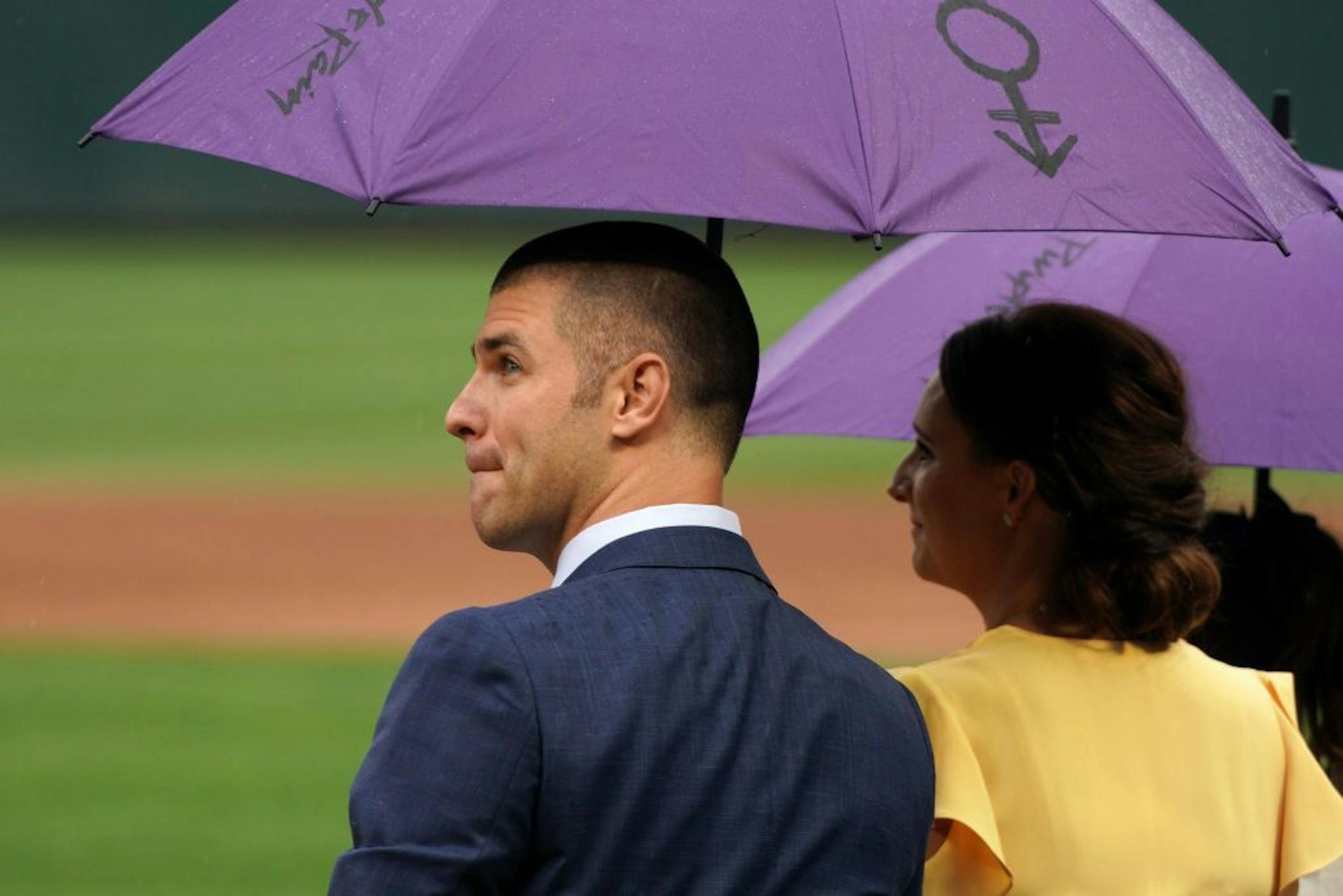 Former Twins great Joe Mauer sat with his wife Maddie and their childen during a pregame ceremony to retire his number 7 Saturday.