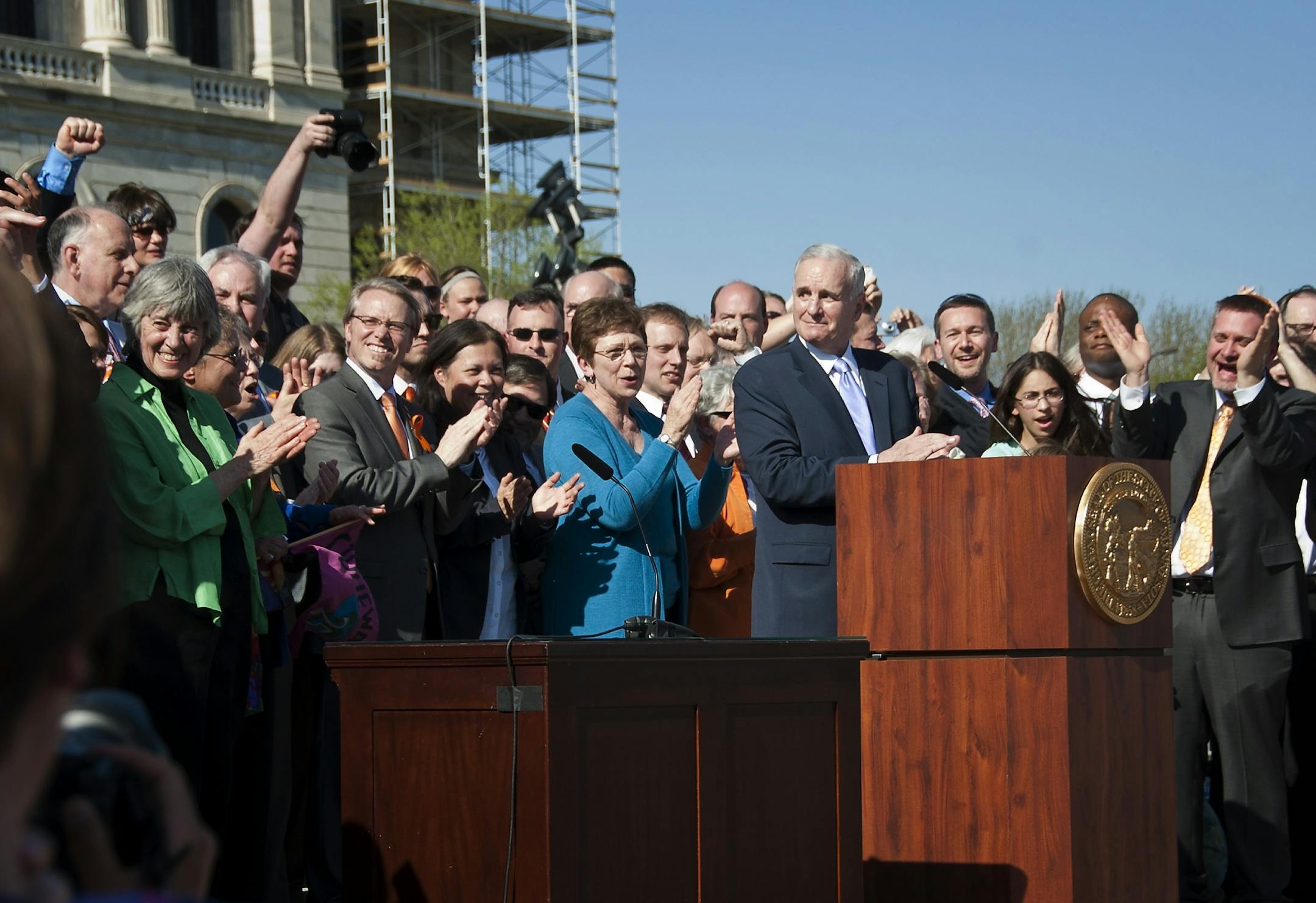Governor Mark Dayton signed the marriage bill into law Tuesday, May 14, 2013 in front he the Capitol