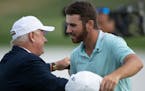 Matthew Wolff, right, hugged executive director Hollis Cavner after winning the 3M Open with an eagle on the final hole Sunday at TPC Twin Cities in B
