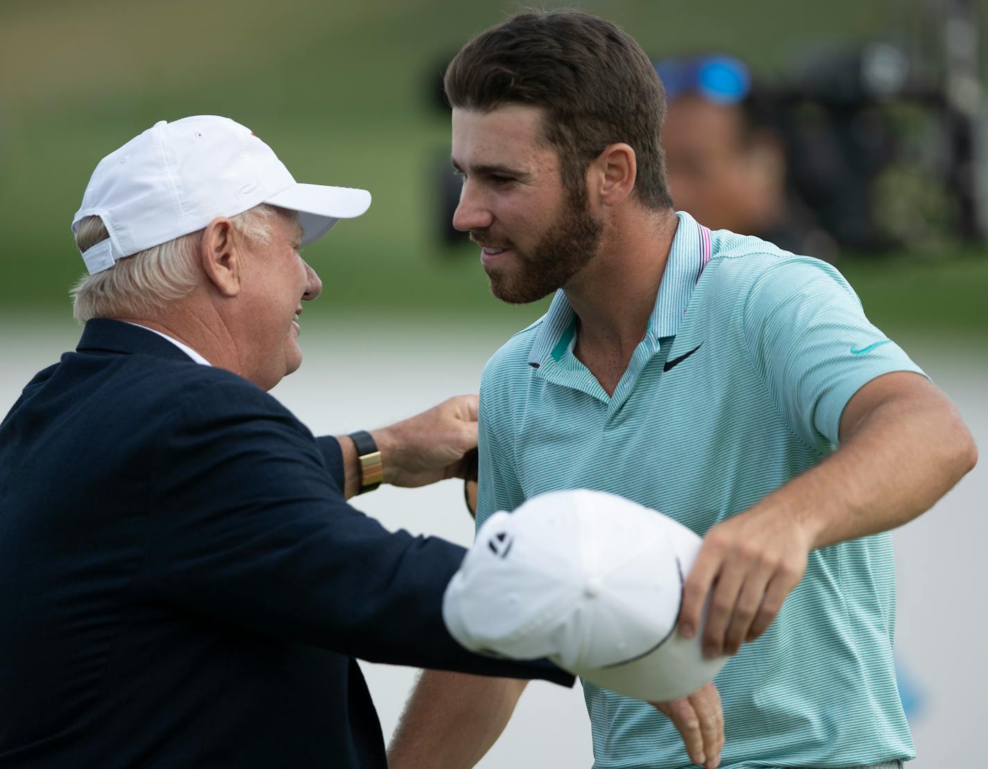 Matthew Wolff, right, hugged executive director Hollis Cavner after winning the 3M Open with an eagle on the final hole Sunday at TPC Twin Cities in Blaine.