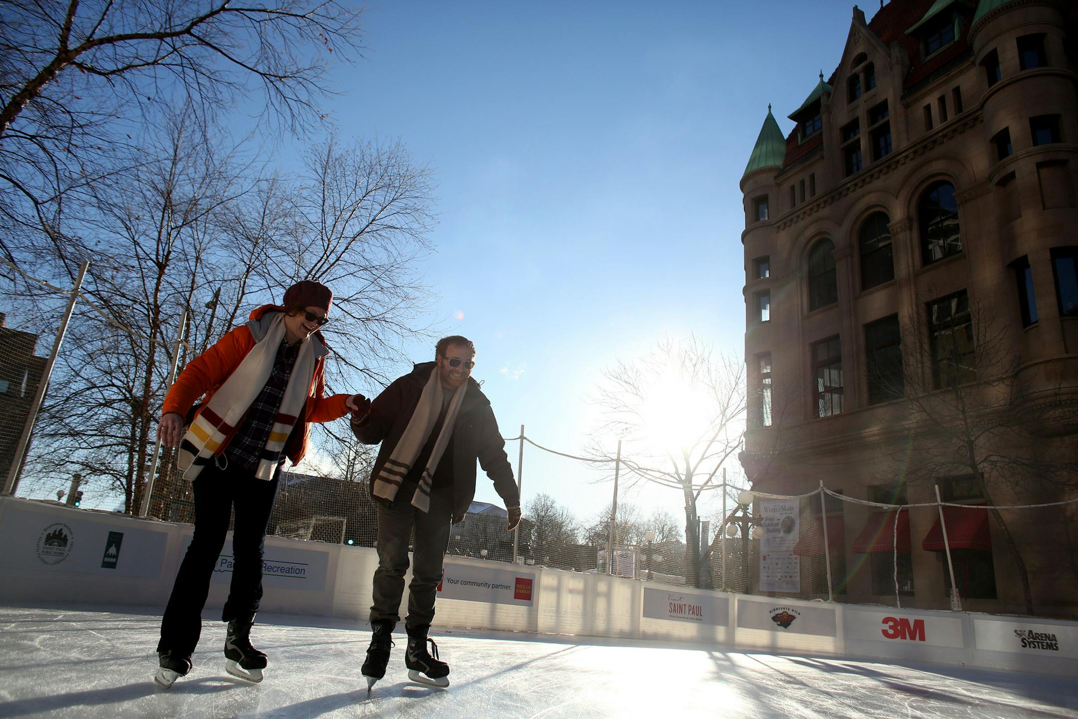 Stephanie Marrs, left, and Kris Fettig held hands as they slowly made their way around the rink at Winter Skate near Rice Park. The two hadn't been on skates since they were very young and wanted to give it a try again. ] (KYNDELL HARKNESS/STAR TRIBUNE) kyndell.harkness@startribune.com in St. Paul , Min., Thursday, December 4, 2014.