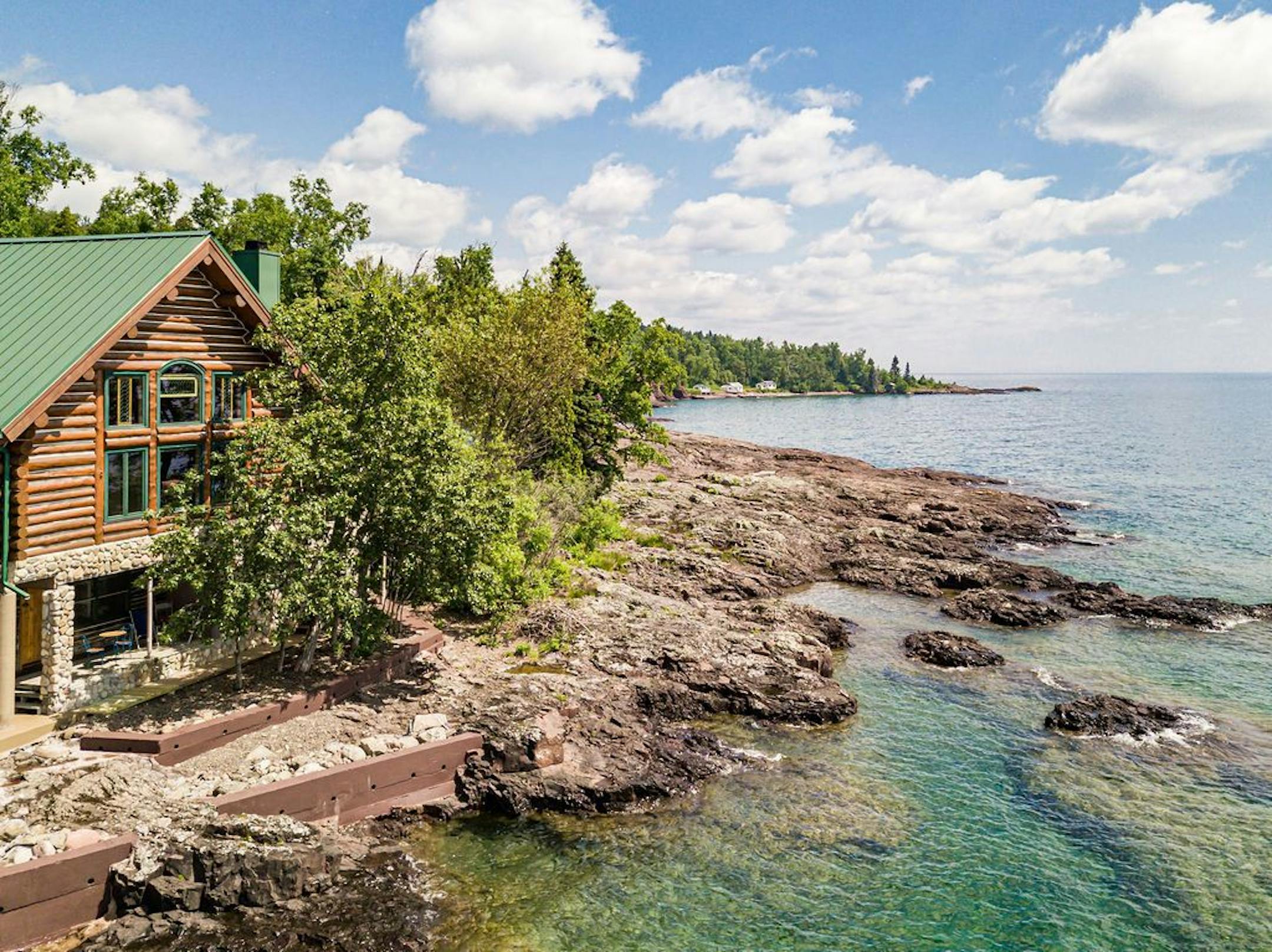 The 4,340-square-foot home features huge windows and sliding-glass doors that frame sweeping views of Lake Superior.