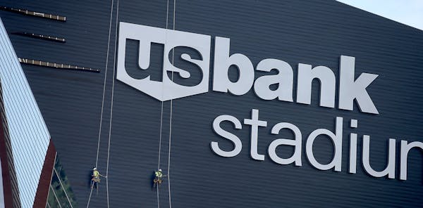 Construction crew worked on panels that were coming off on the side of the US Bank Stadium, Wednesday, July 6, 2016 in Minneapolis, MN.