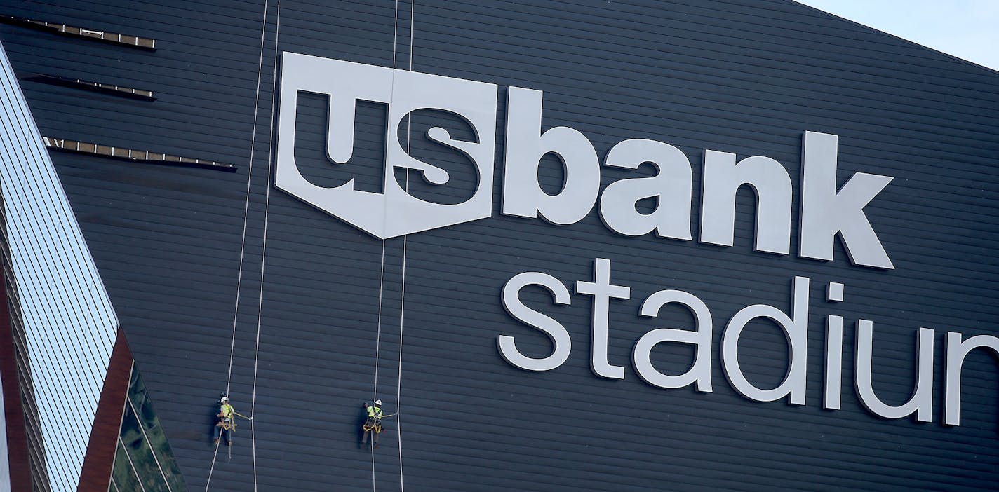 Construction crew worked on panels that were coming off on the side of the US Bank Stadium, Wednesday, July 6, 2016 in Minneapolis, MN.