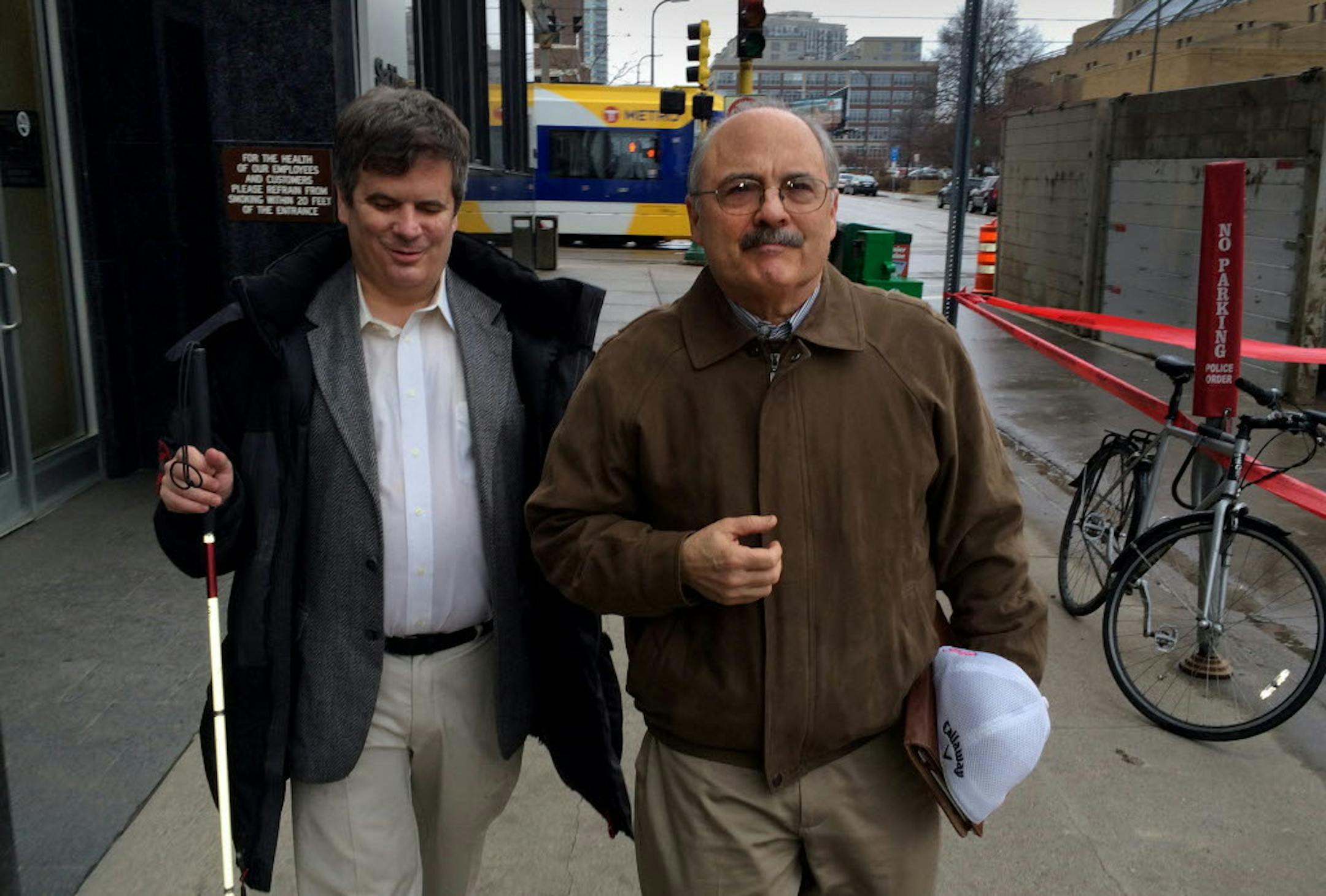 Lawyer-entrepreneur Michael Hanson (left with cane) and Harlan Jacobs, the veteran small-business developer.