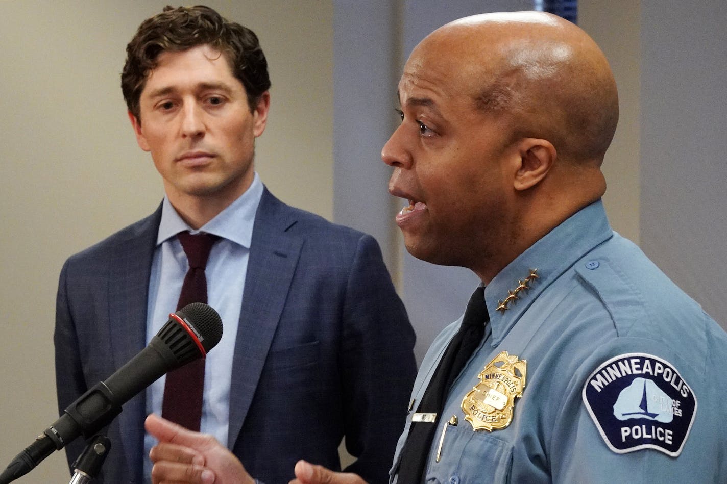 Minneapolis Mayor Jacob Frey, standing a distance from police Chief Medaria Arradondo, watched as the chief outlined how the city will enforce the new stay-at-home order during a press conference Friday. ] ANTHONY SOUFFLE • anthony.souffle@startribune.com Minneapolis Mayor Jacob Frey and police Chief Medaria Arradondo held a press conference to outline how the city will enforce the new stay-at-home order Friday, March 27, 2020 at City Hall in Minneapolis.